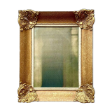 Old wall frame in carved gilded wood