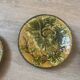Four antique dessert plates in majolica with vine decoration.