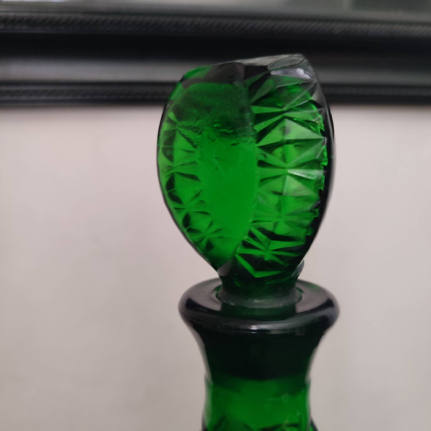 Vintage green carafe in chiseled glass