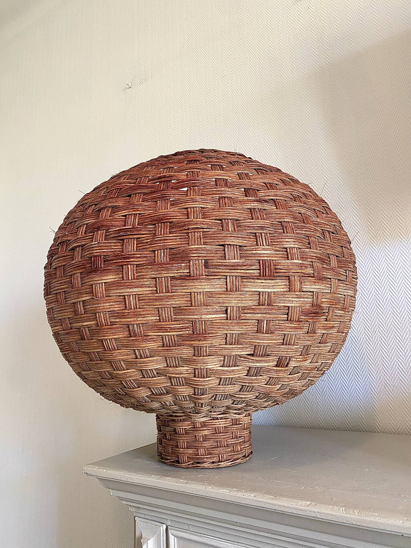 Large vintage lampshade made of hand-woven rattan.