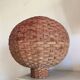 Large vintage lampshade made of hand-woven rattan.