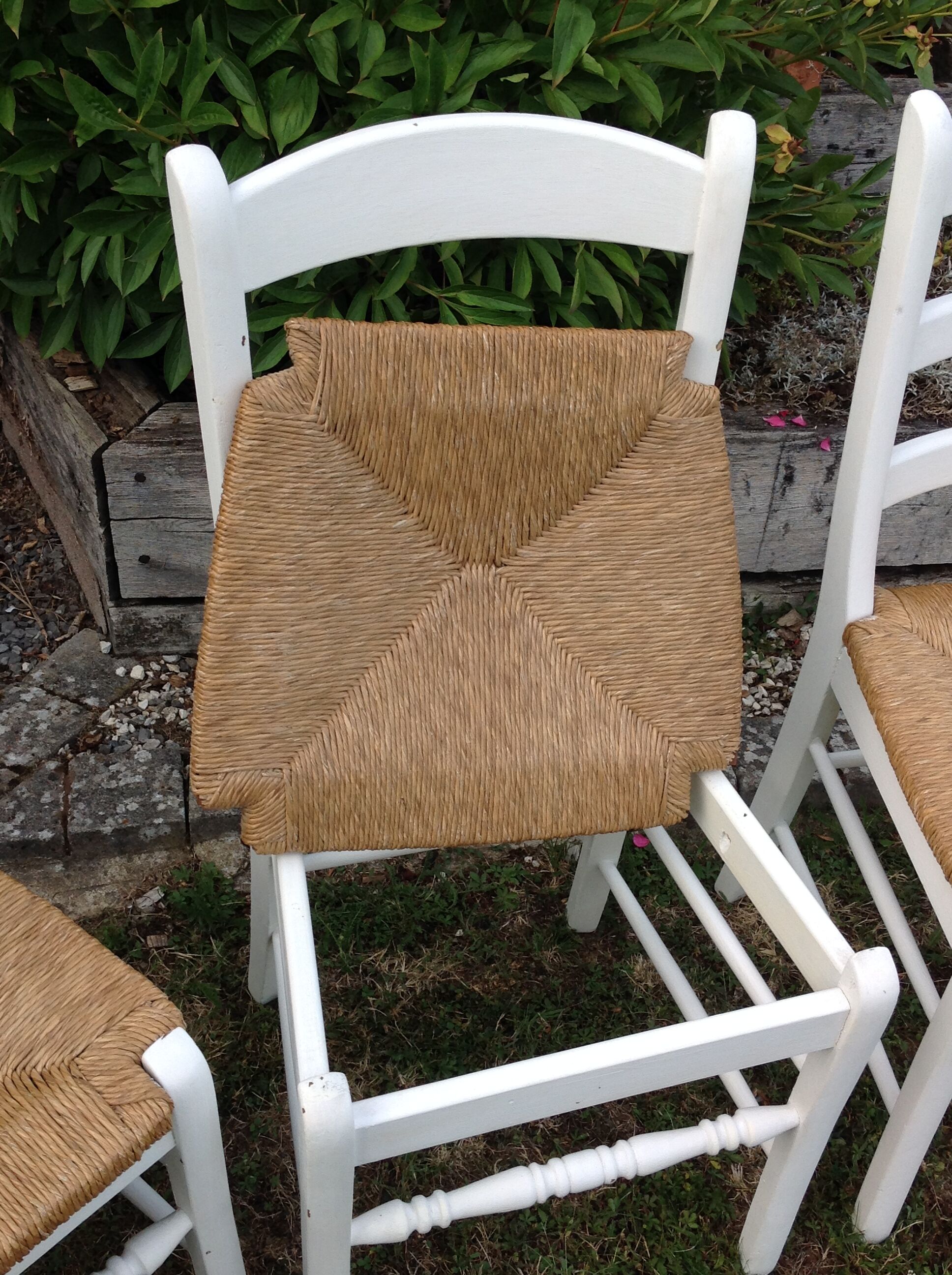 White farmhouse table set and four chairs