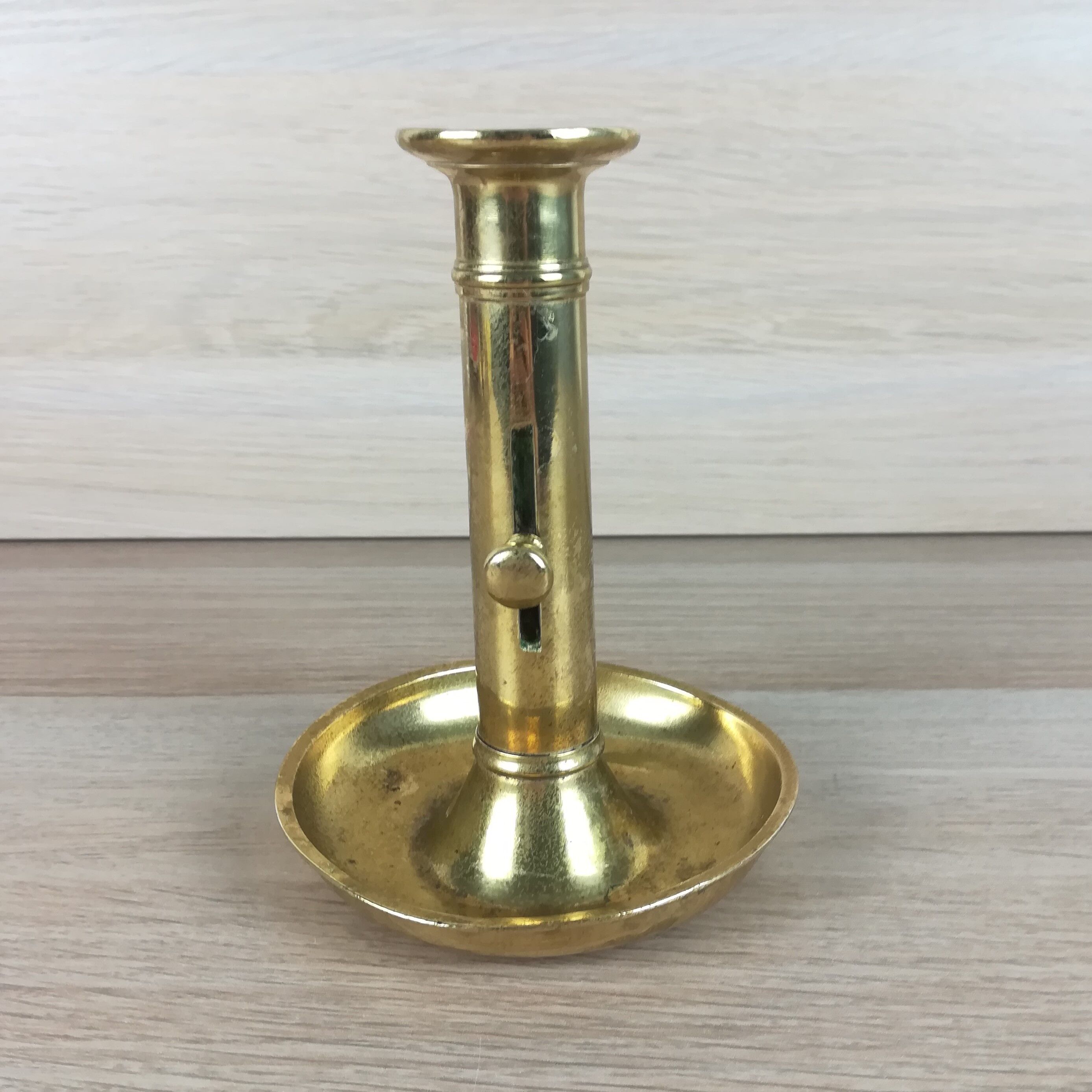 Brass pusher candle holder