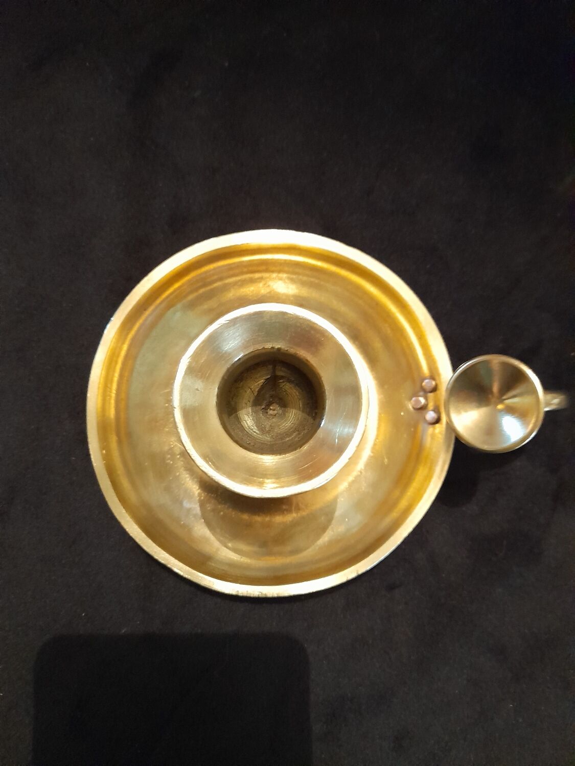 Tailed candle holder.