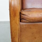 Characteristic sheepskin design armchair in beautiful warm cognac colours