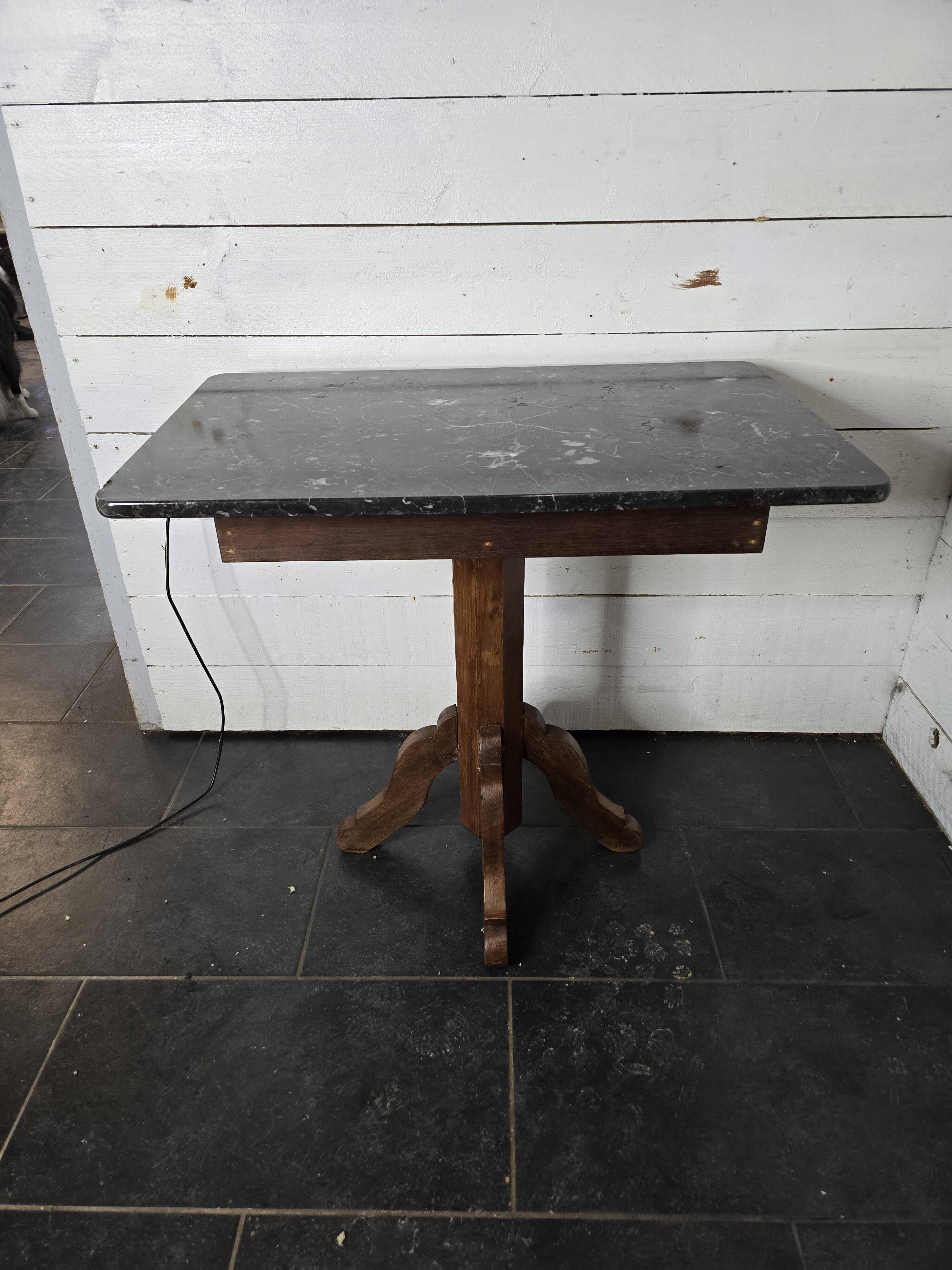 Old pedestal table with oak legs and marble top