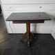 Old pedestal table with oak legs and marble top