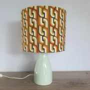 Seventies spirit lamp with geometric orange/green lampshade.