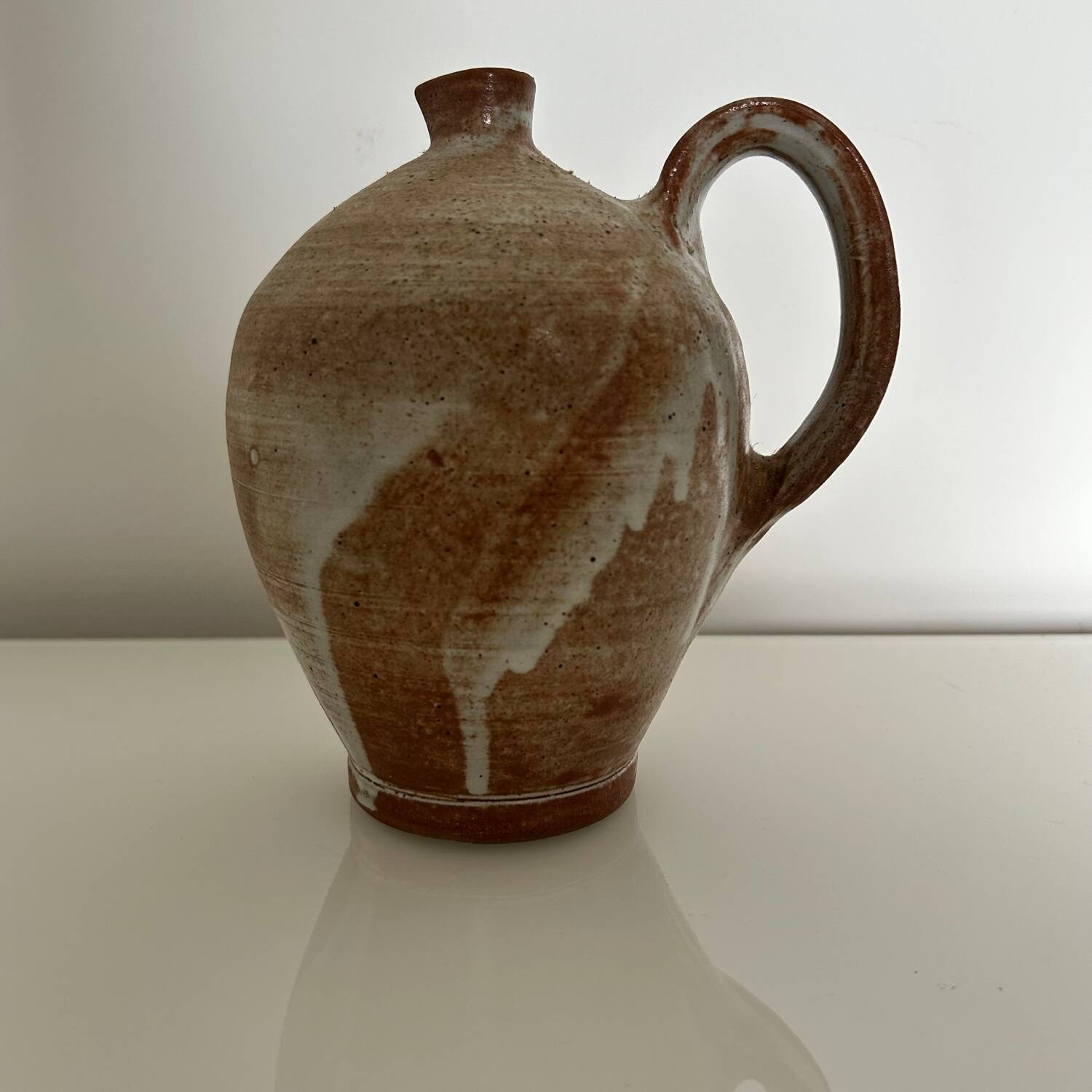 Patinated stoneware jug