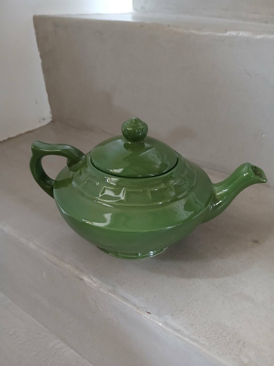 Green earthenware teapot