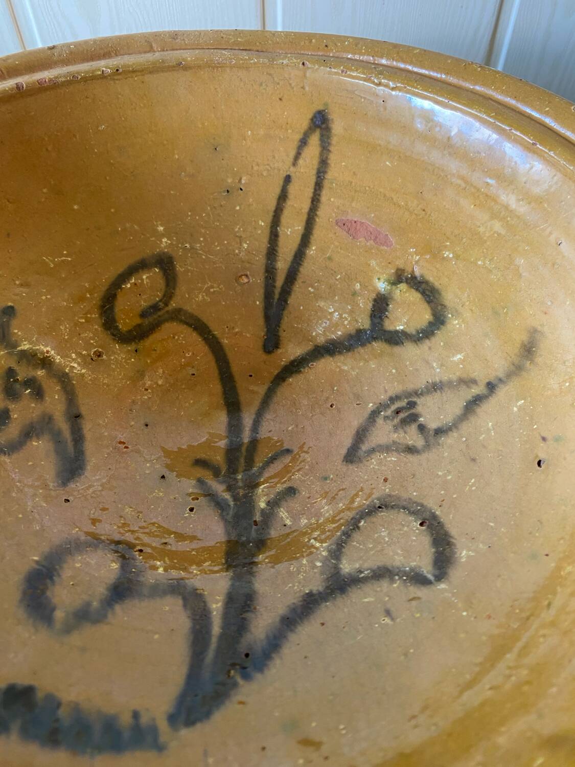 Old glazed terracotta dish