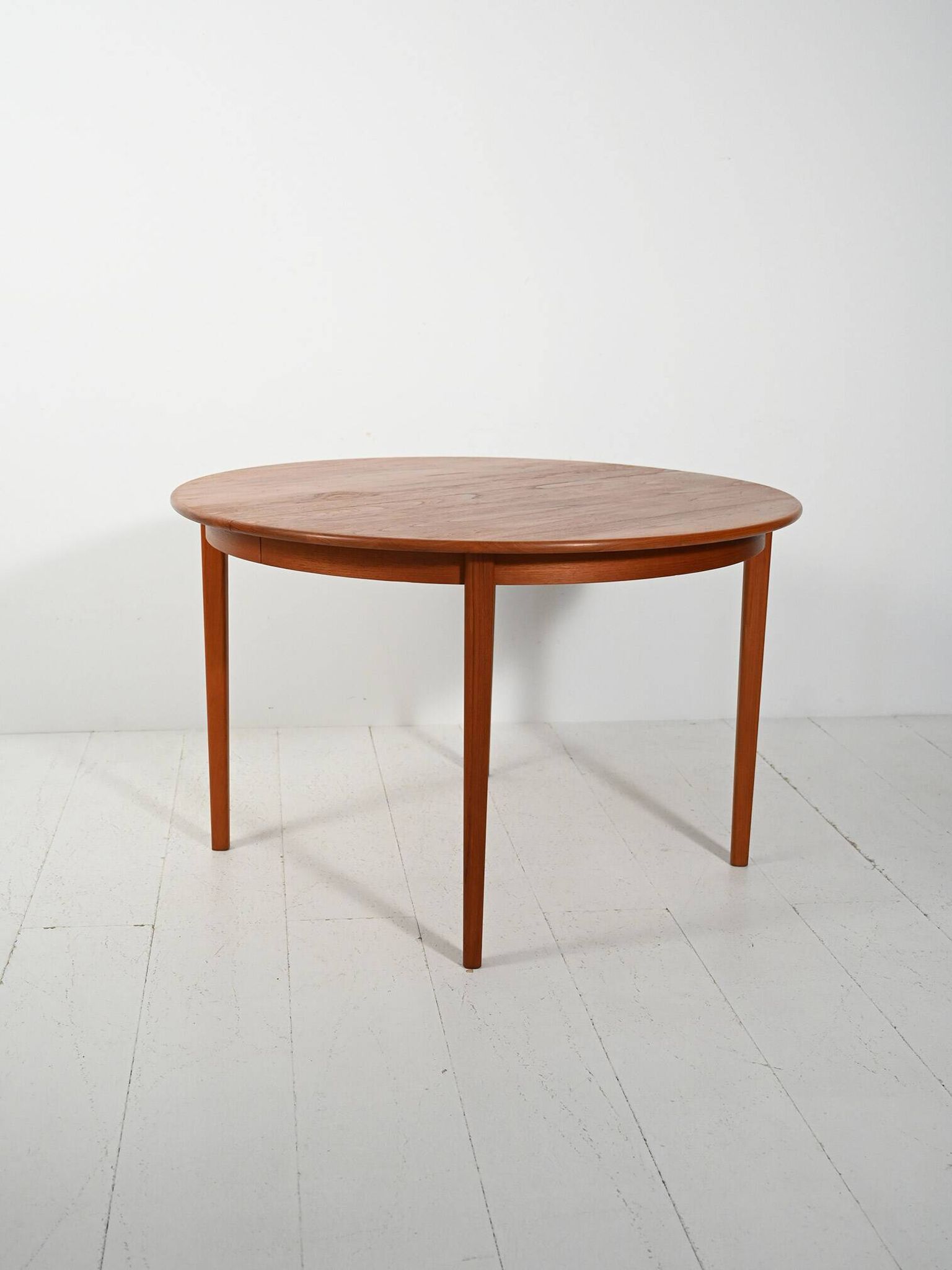 Round extendable teak table by Svante Skogh