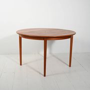 Round extendable teak table by Svante Skogh