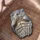 Empty pocket pair hand lucky charm brass