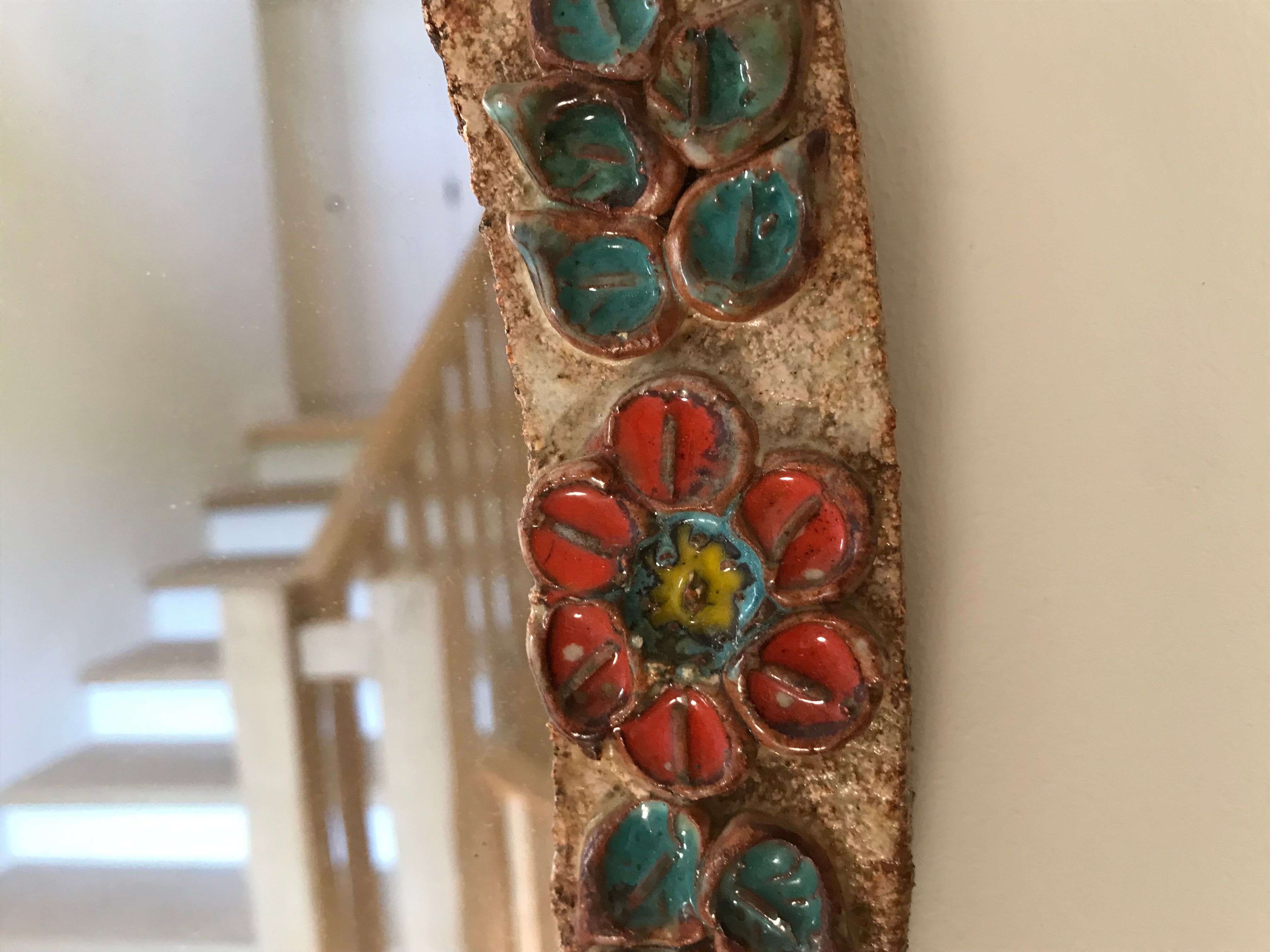 Ceramic mirror decorated with flowers, circa 1960 25x40cm