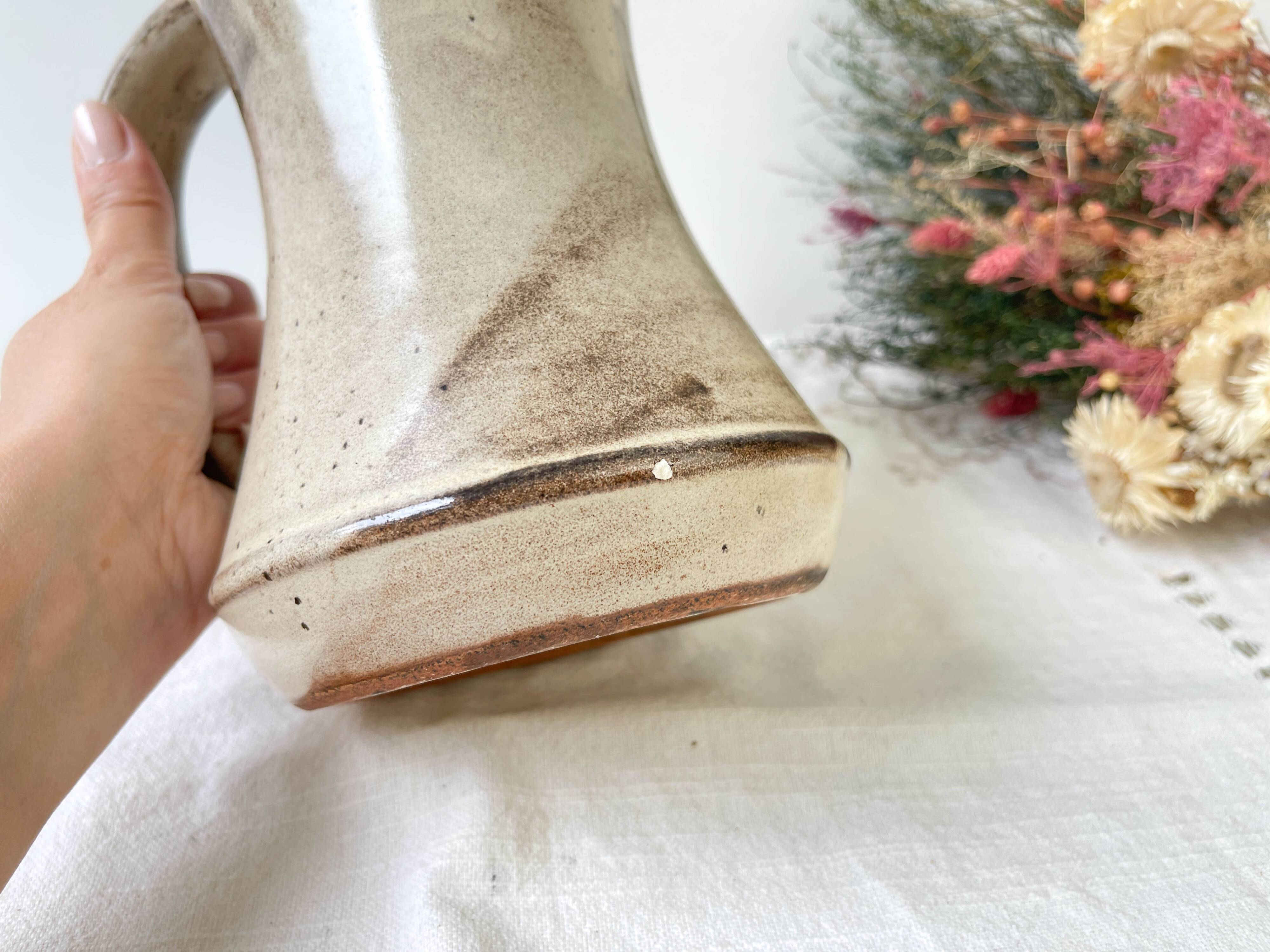 Ceramic pitcher from Les grottes dieulefit with floral pattern from the 1970s