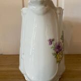 Old ceramic pitcher decorated with flowers