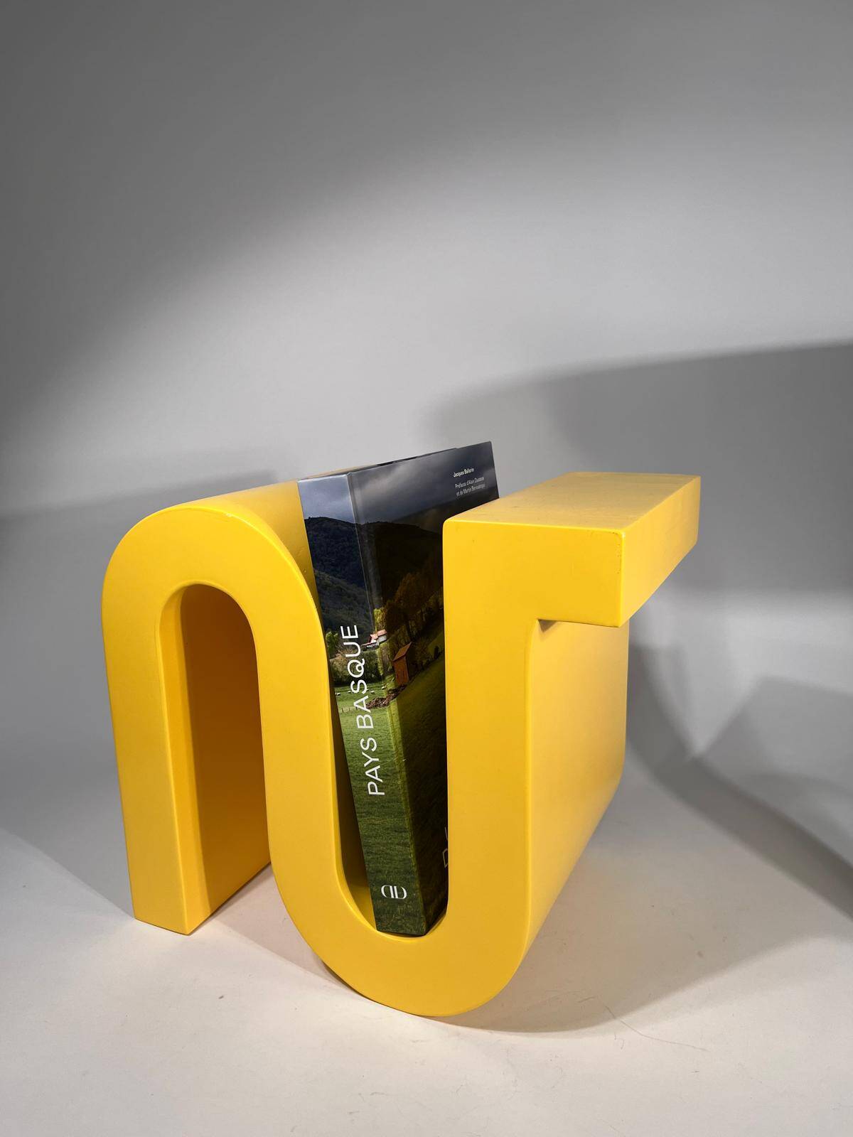 Yellow book or magazine holder by Axel Chay for Monorpix