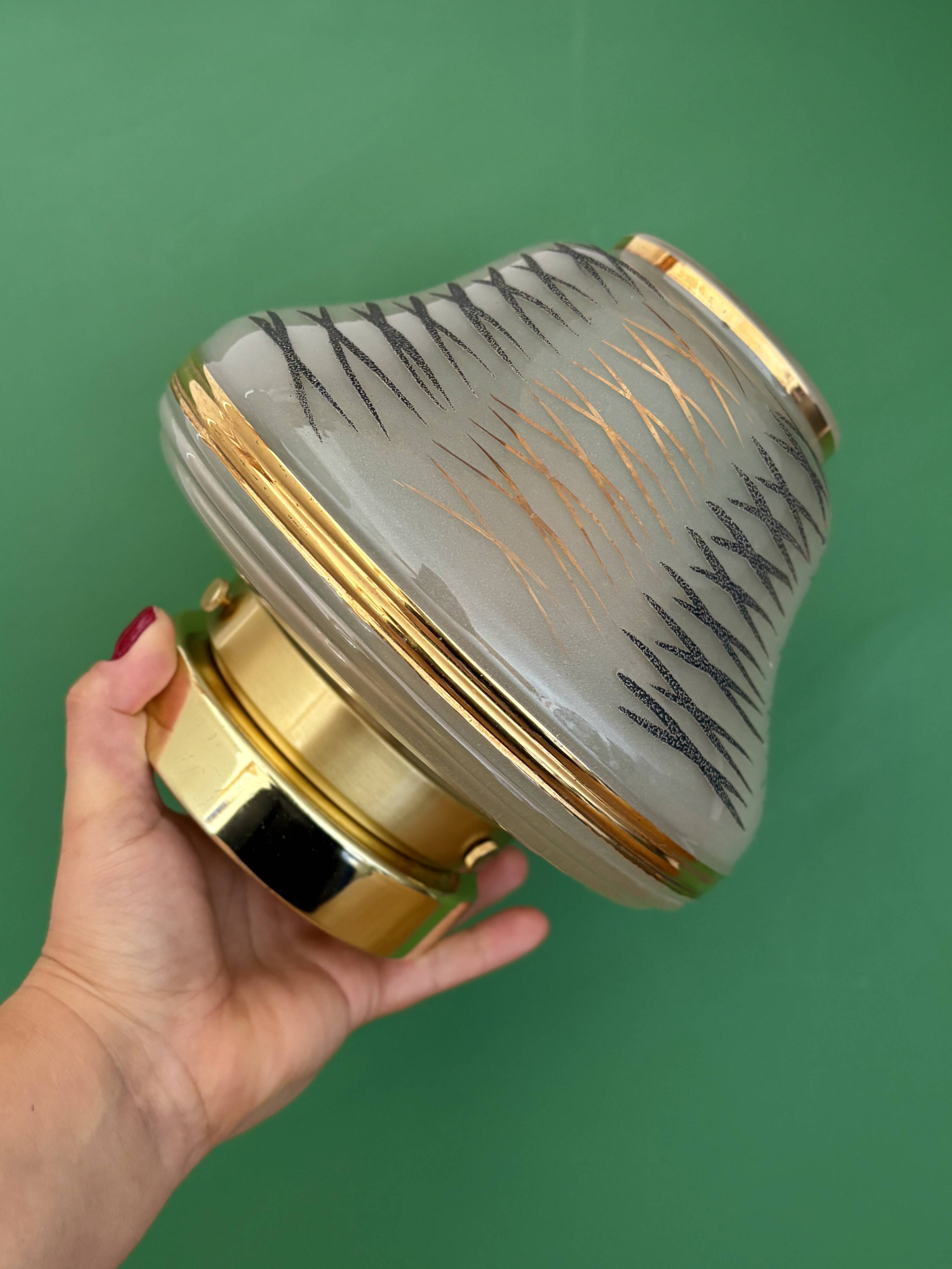 Vintage Art Deco globe wall/ceiling light in white, black, and gold glass.