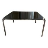Table basse vintage en metal chromé et verre fumé