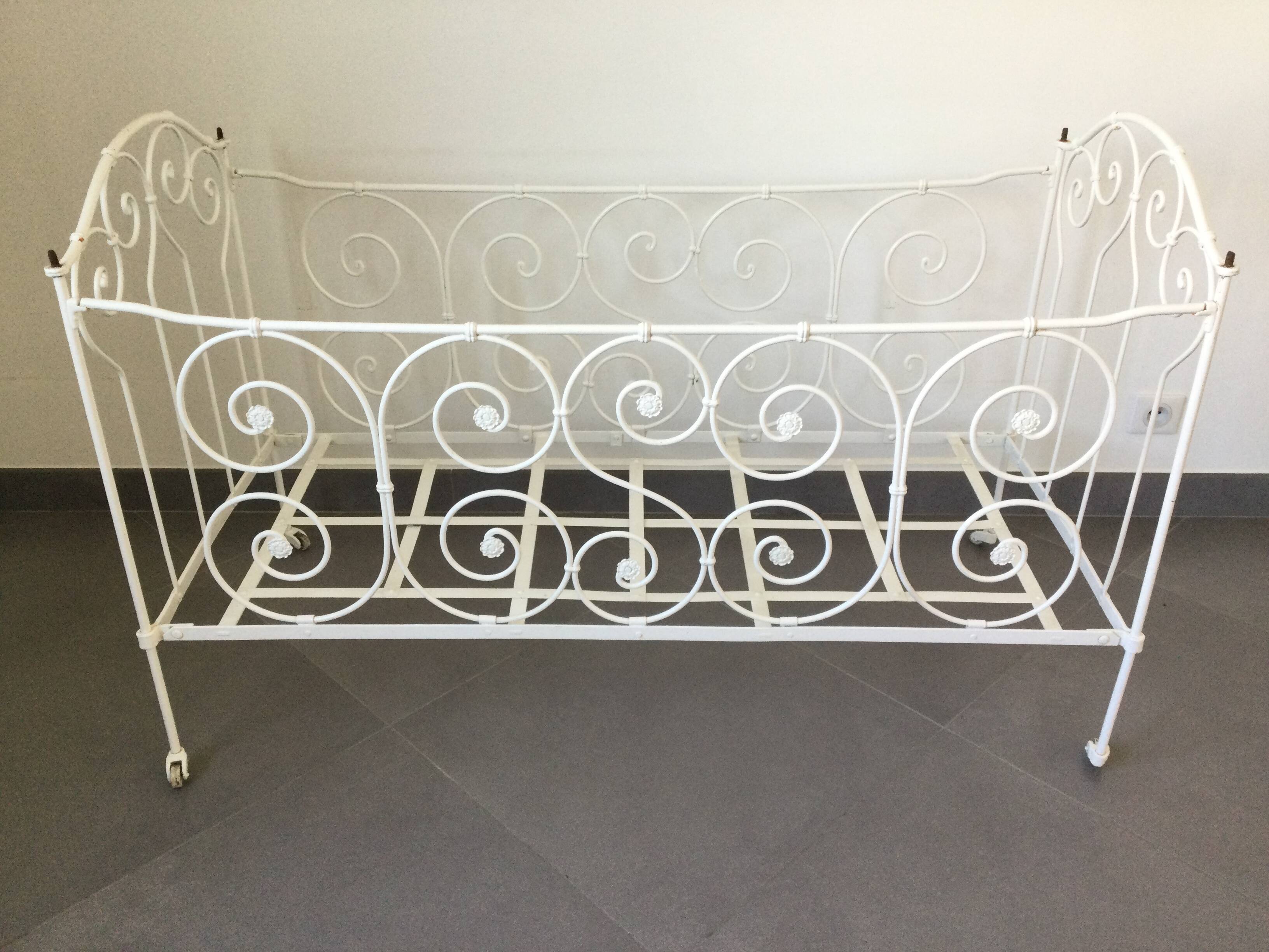 White wrought iron folding bed