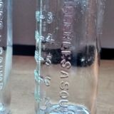 2 old graduated pharmacy bottles