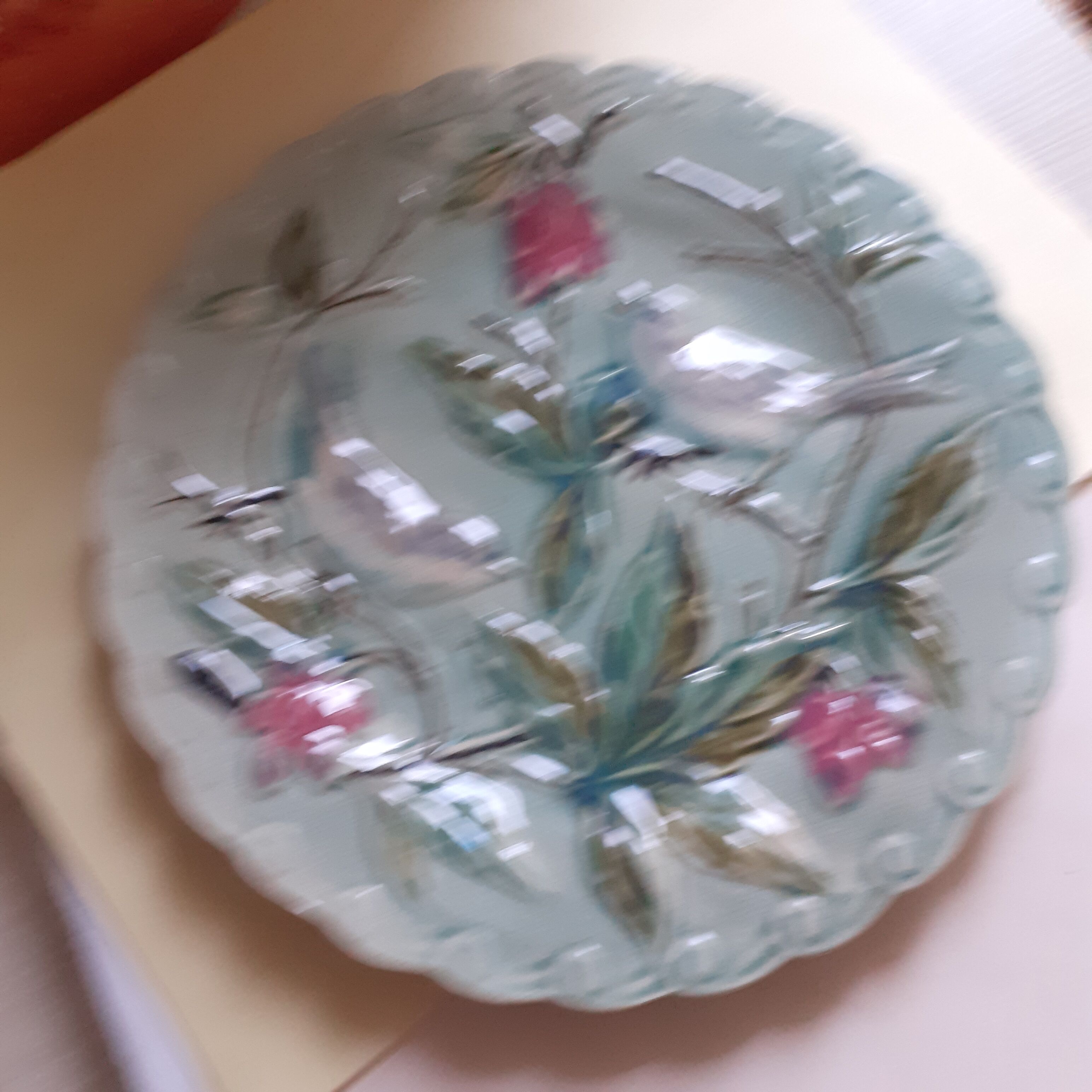 Light turquoise slip plate. Birds.