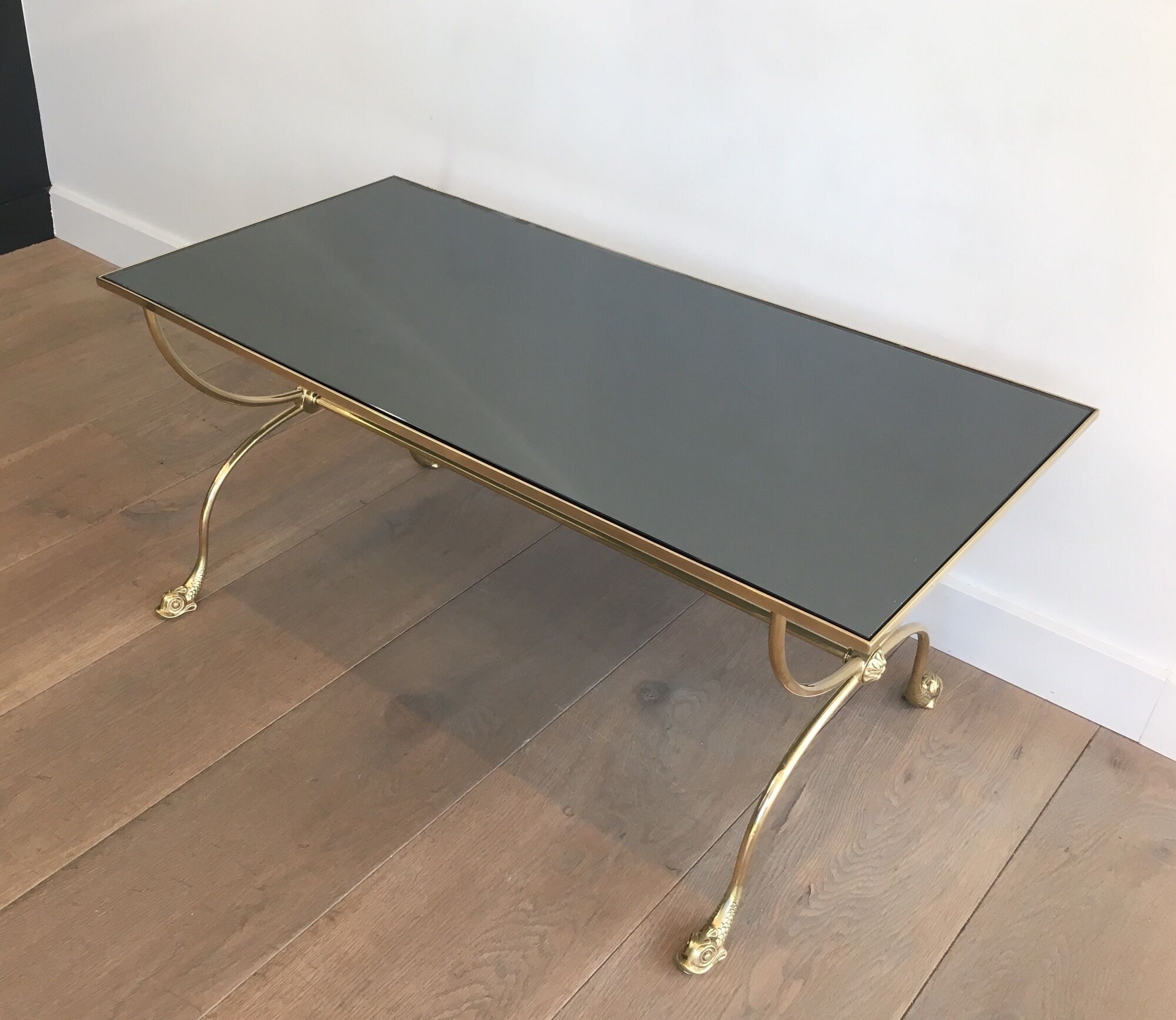 Neoclassical brass style coffee table with dolphin head decoration