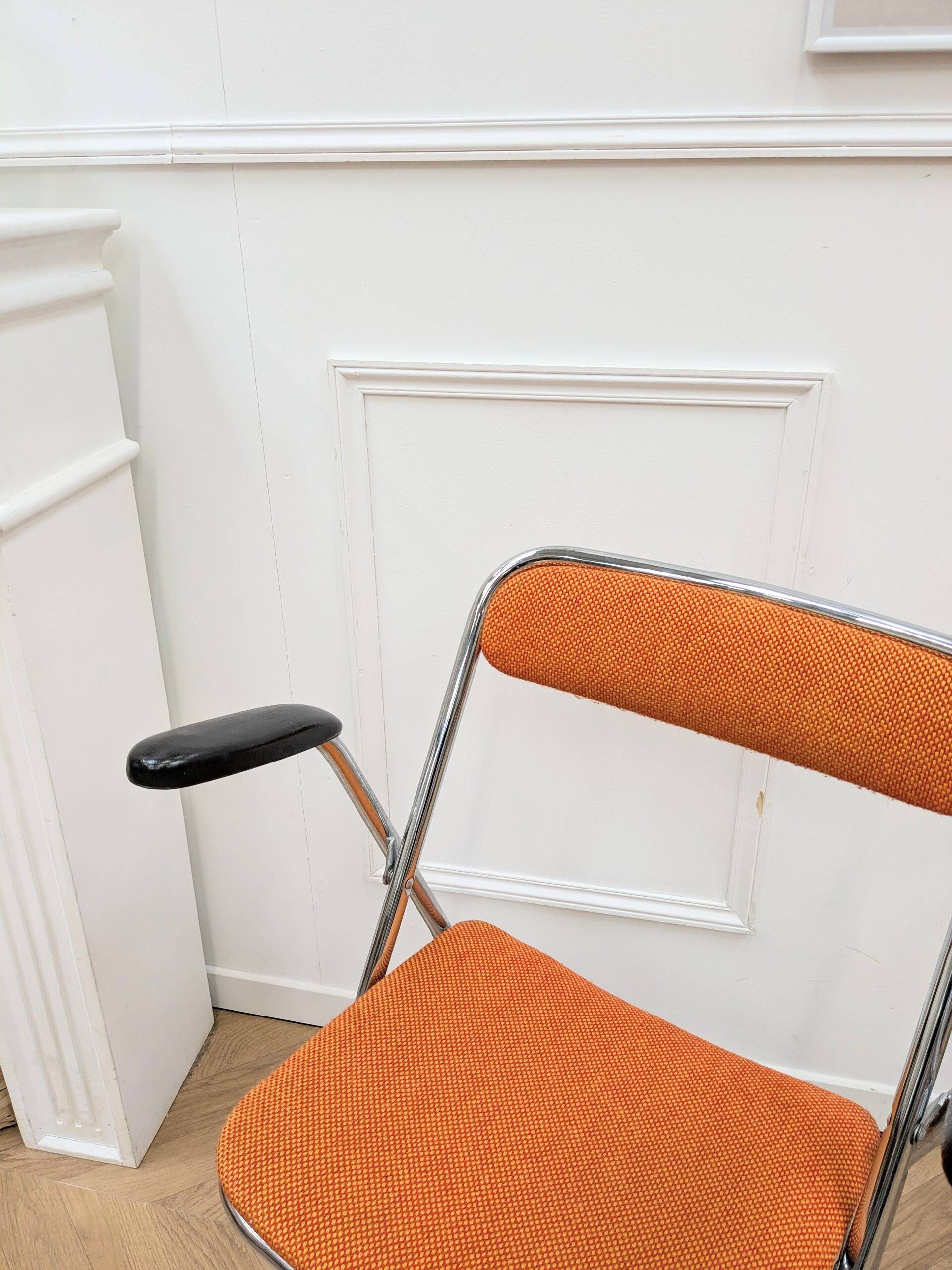 6 orange folding chairs