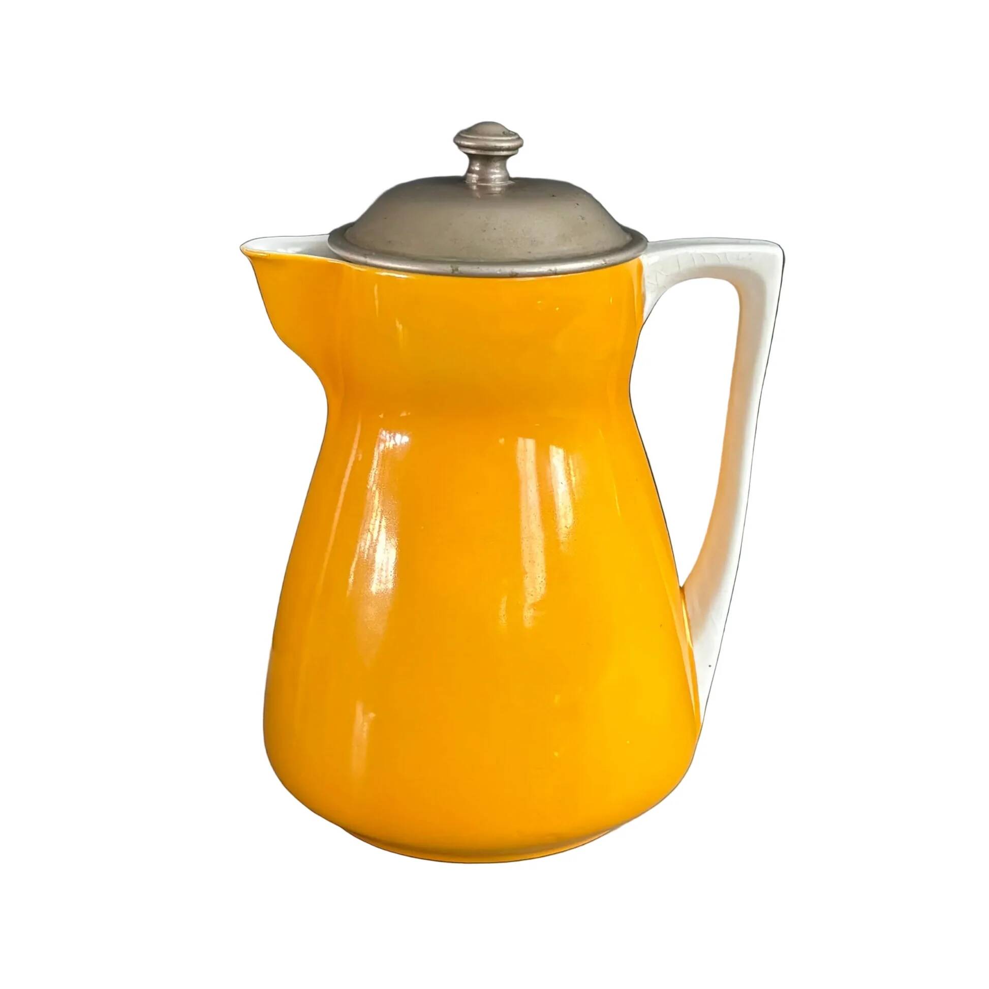 Antique teapot in earthenware with a tin filter lid.