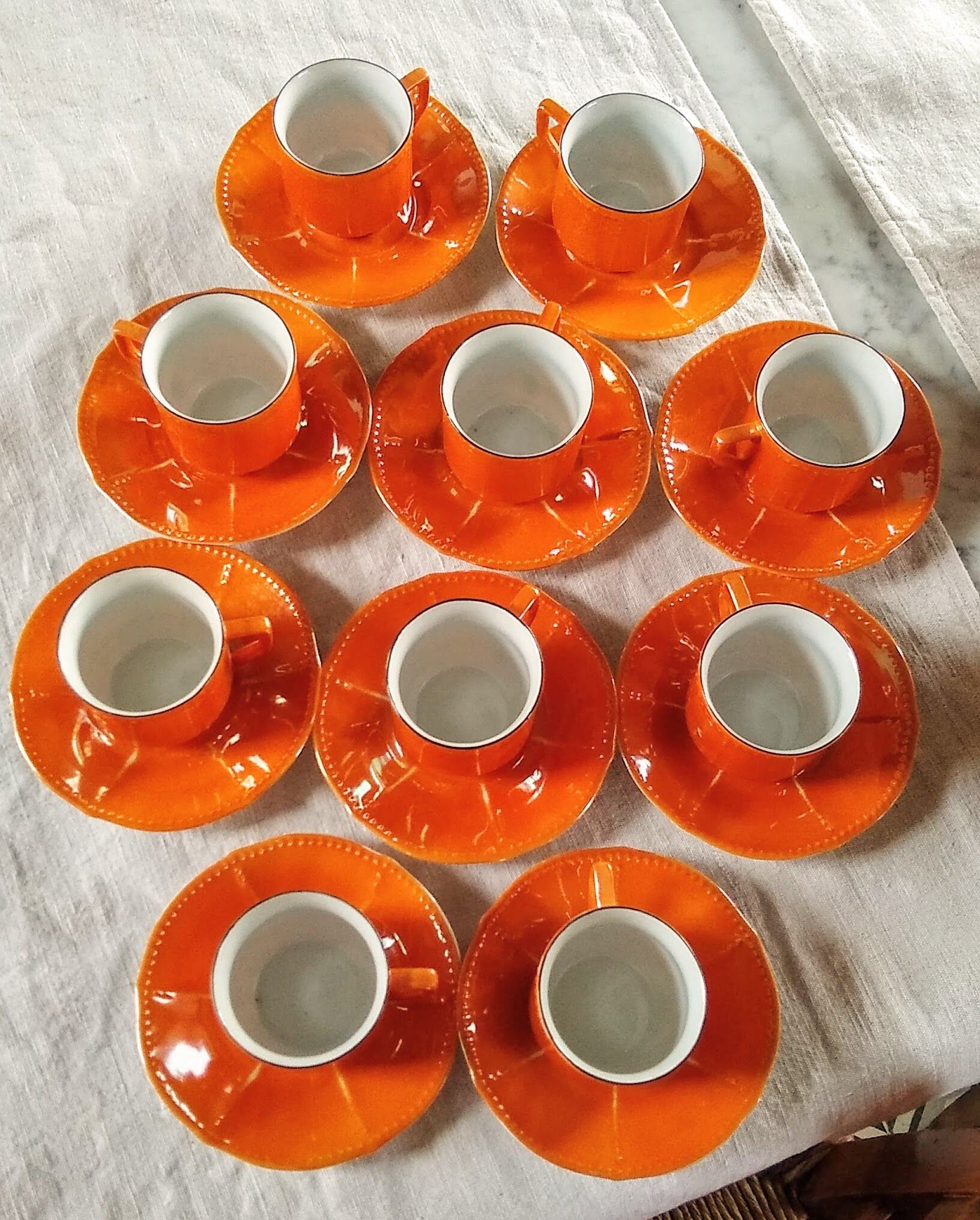Iridescent orange porcelain coffee set from the 50s-60s with black edging