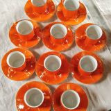 Iridescent orange porcelain coffee set from the 50s-60s with black edging