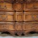 Louis XV style crossbow chest of drawers stamped in solid cherry wood