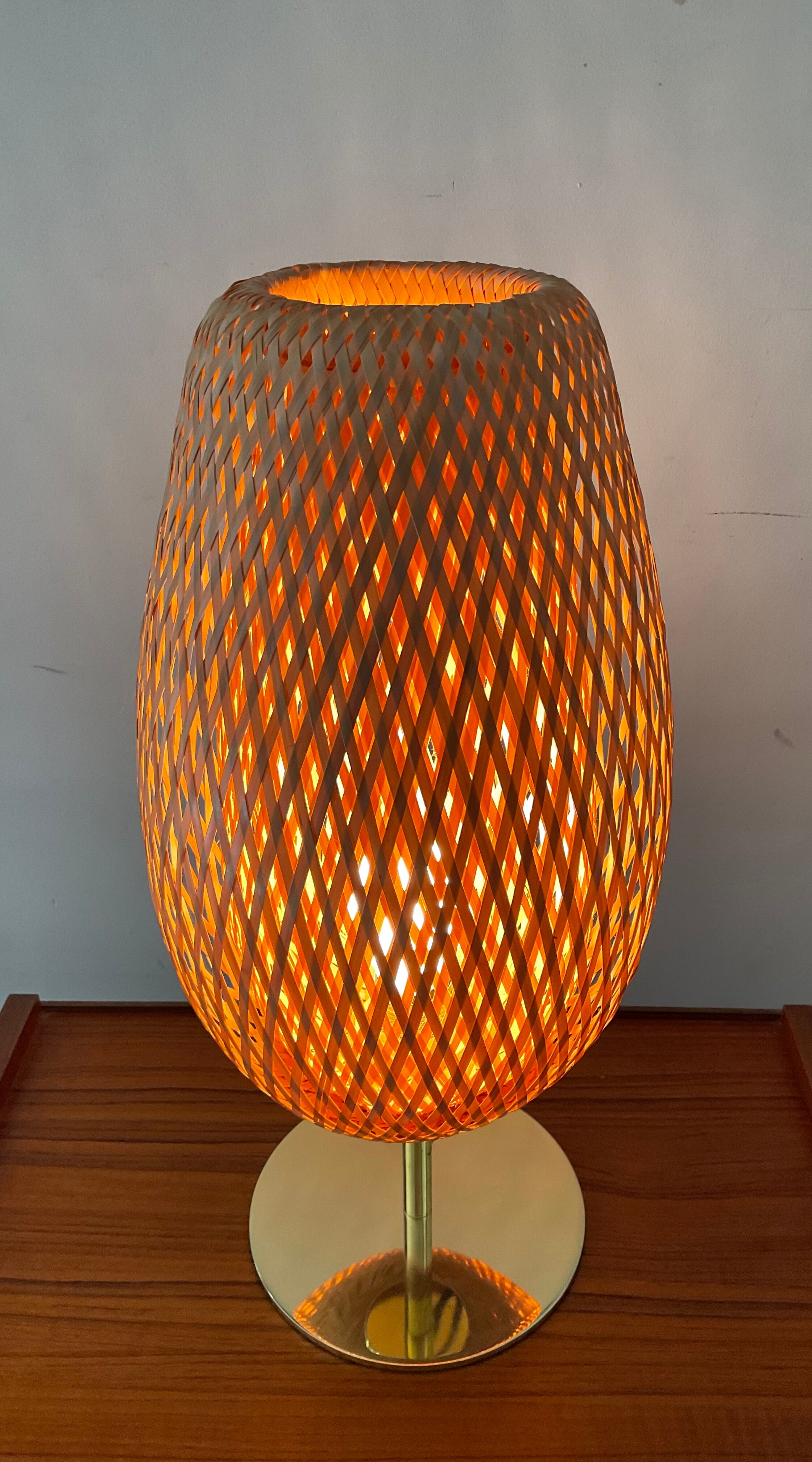 Design lamp in gold metal and wicker
