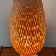 Design lamp in gold metal and wicker