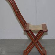 Antique Chinese folding chair with carvings, circa 1900-1920.
