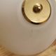 Brass wall lamp with vintage articulated arm, glass and brass shade