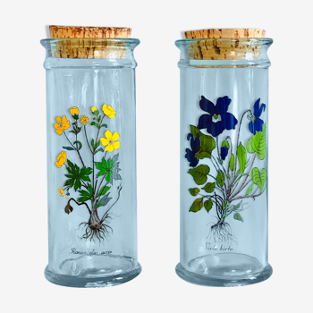 Pair of decorated glass and cork kitchen pots