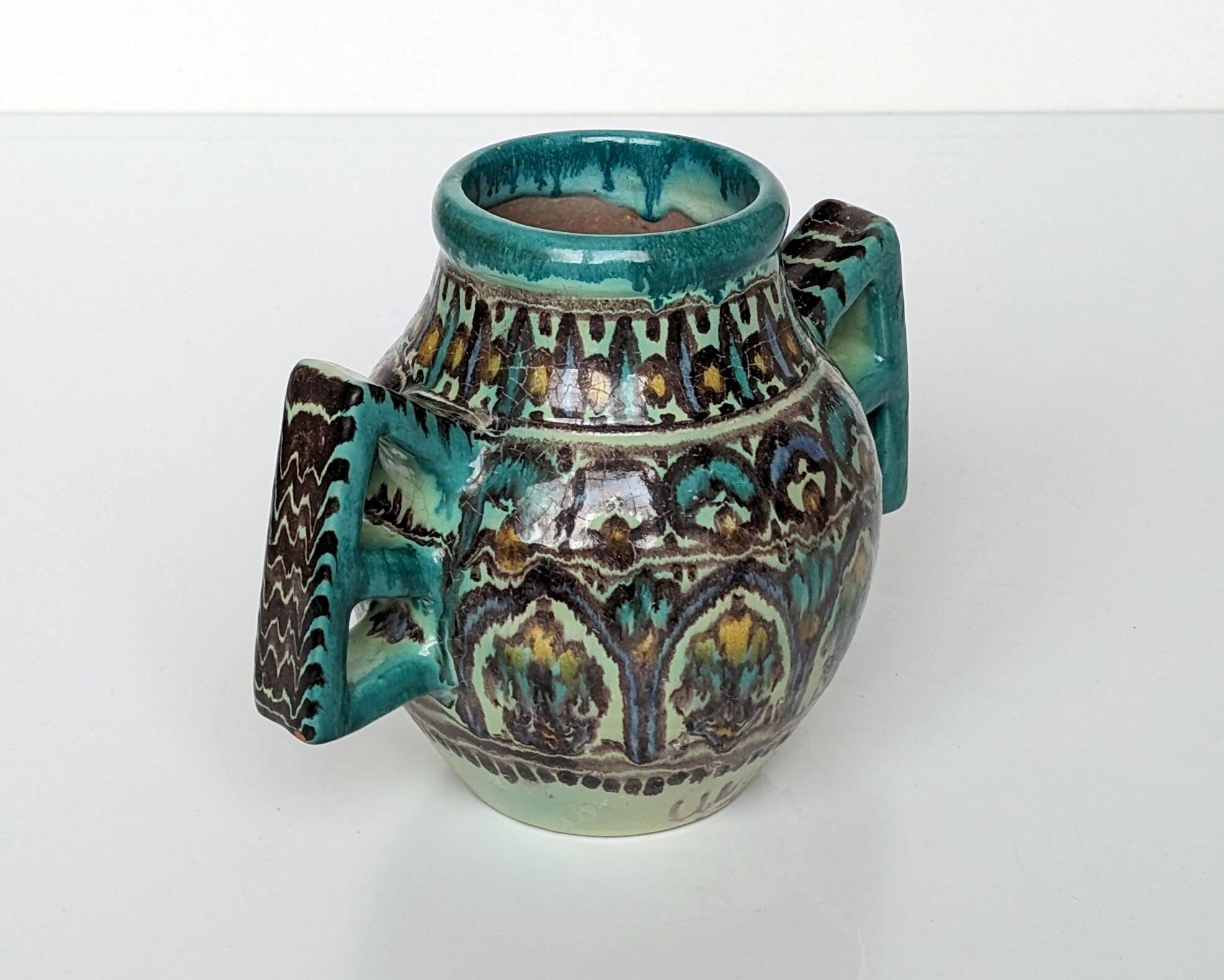 Polychrome ceramic vase in flowing enamel from Nabeul with mihrab decoration.