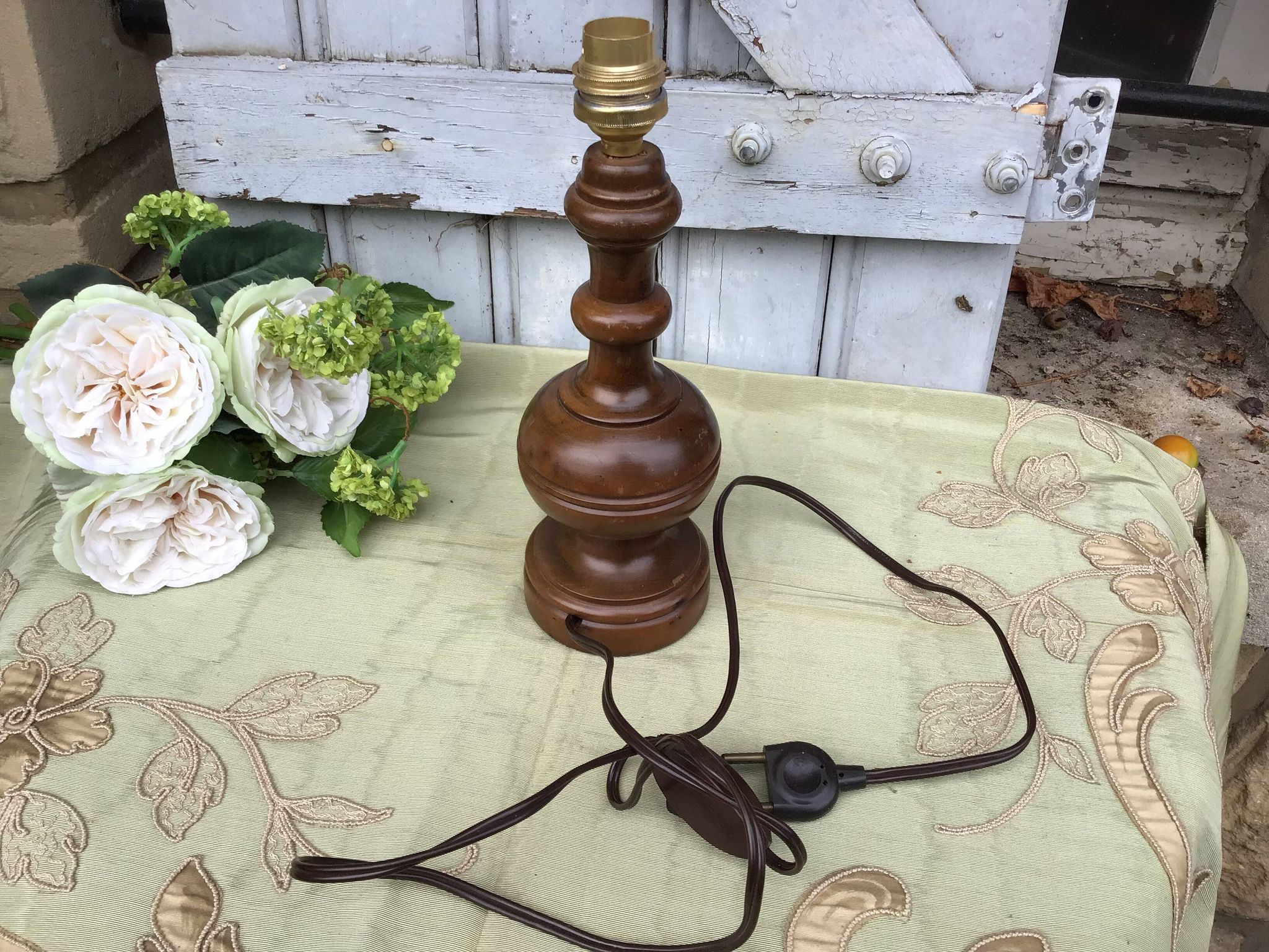 Turned wooden foot lamp with pleated lampshade