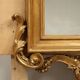 Eclectic antique mirror in carved and gilded wood, Italy, 19th century.