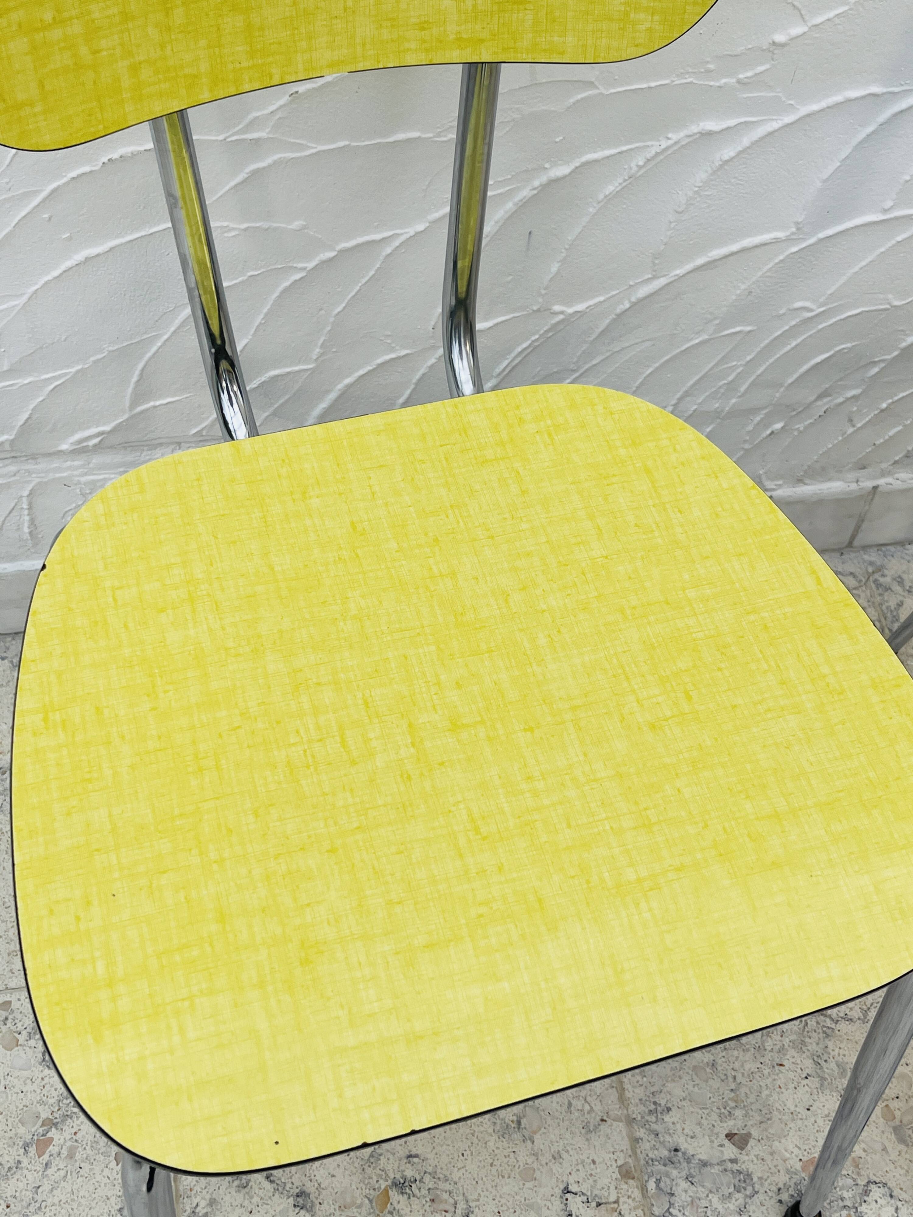Pair of vintage yellow chrome Formica kitchen chairs.