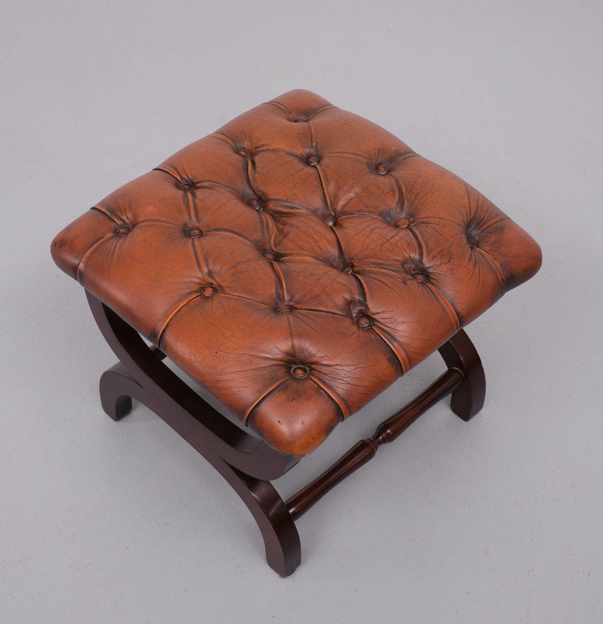 English country house style padded leather ottoman