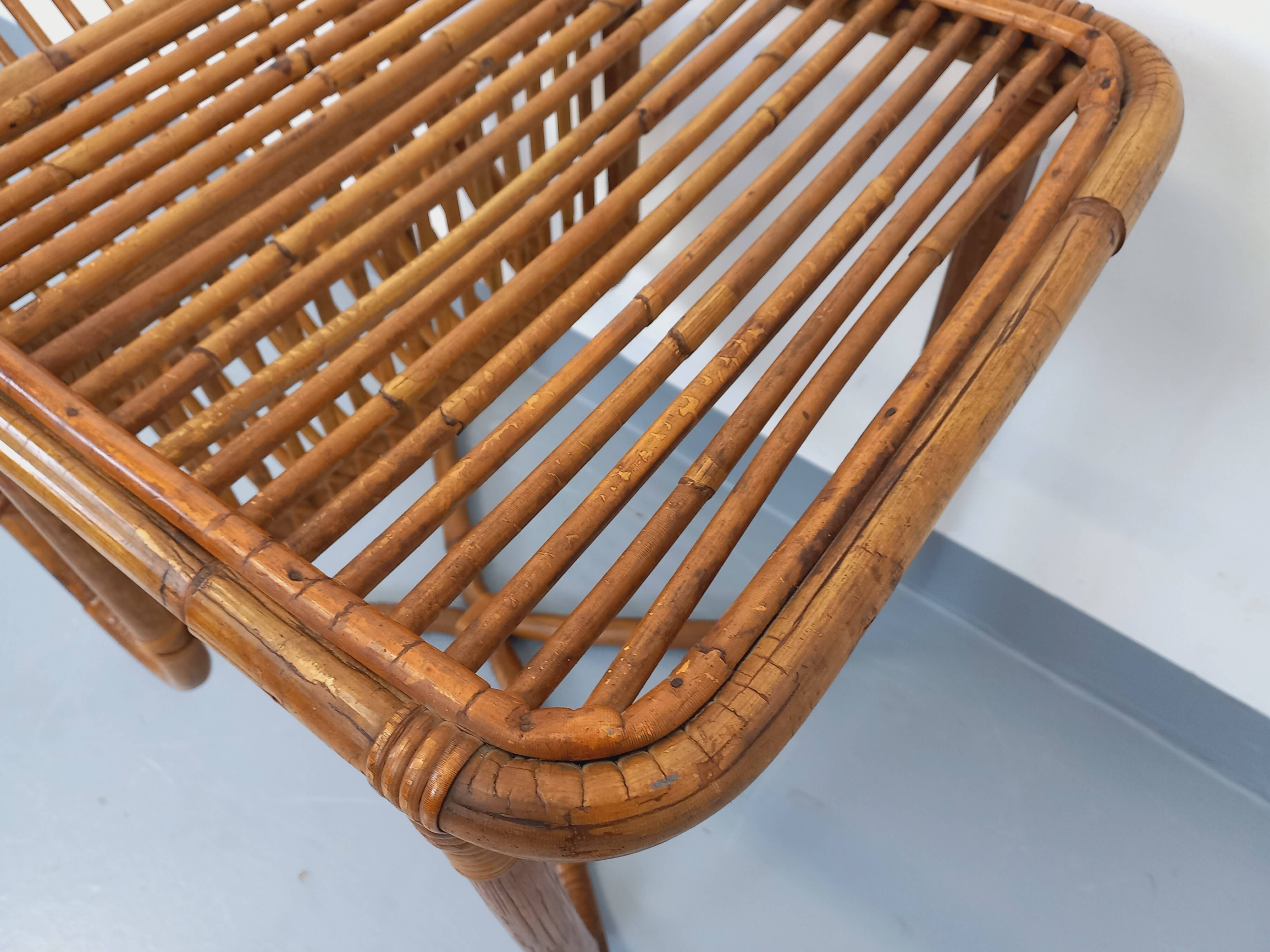 Side table / coffee table with vintage 1960s rattan magazine rack.