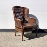 Fauteuil en rotin avec siège en cuir marron