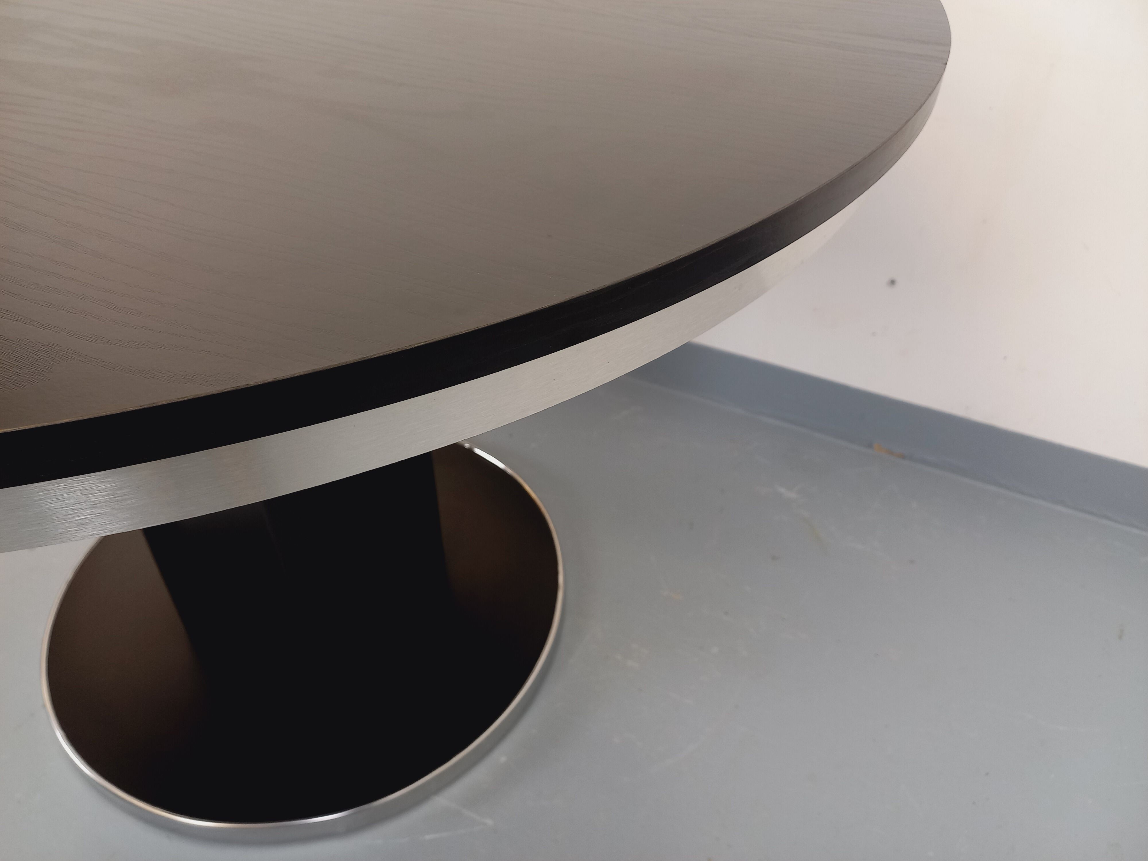 Vintage dining table in melamine with a black wood effect and chrome metal.