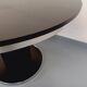 Vintage dining table in melamine with a black wood effect and chrome metal.