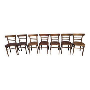 7 curved wooden bistro chairs by Baumann