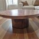 Vintage round wooden coffee table with a copper top.