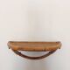 Vintage half-moon rattan shelf